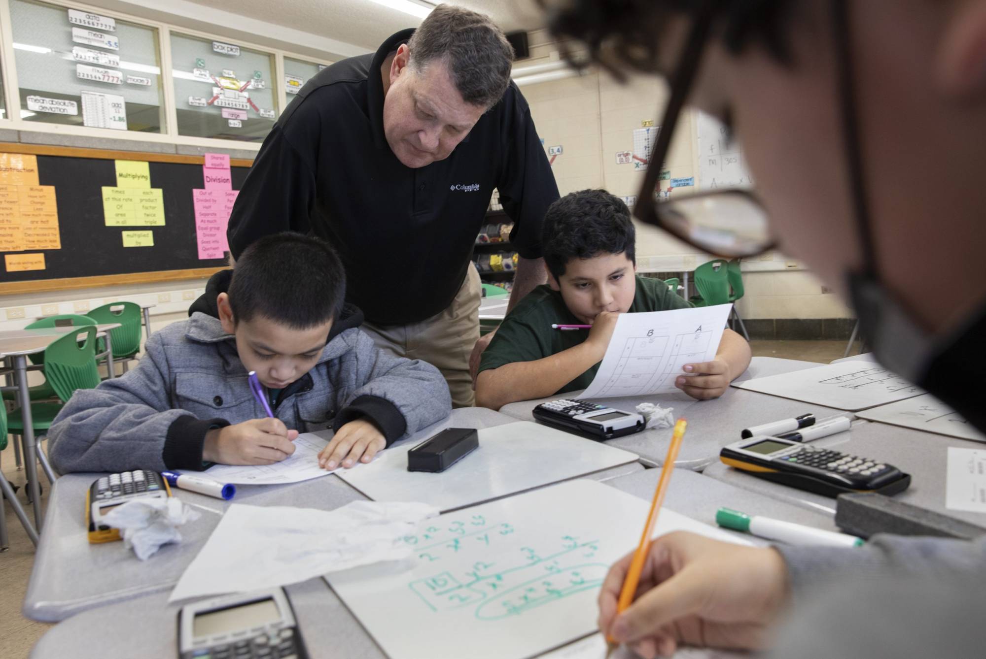 Male teacher with students