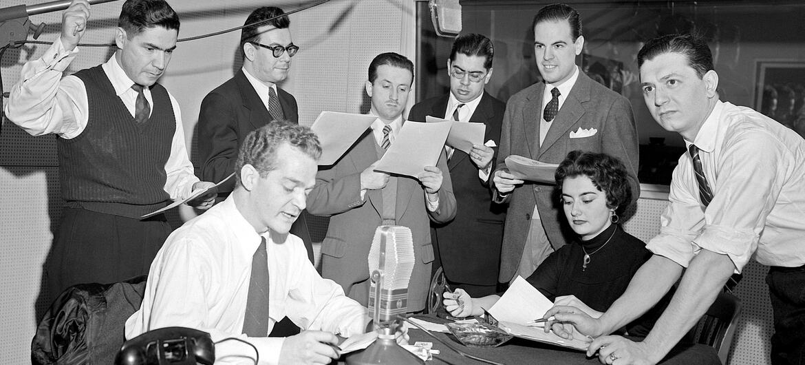 From left to right:  José Quijano-Santos; Luis Marron; Hernando Solano; Jorge A. Carvallo, Luis Carlos Sanchez, Osvaldo Lopez Noguerol; Beatrix Alcapra Cuellar; and Guillermo Caram, members of the staff of the UN Radio Division are recording a special broadcast for the radio networks of the Latin American countries, at UN Headquarters in New York.