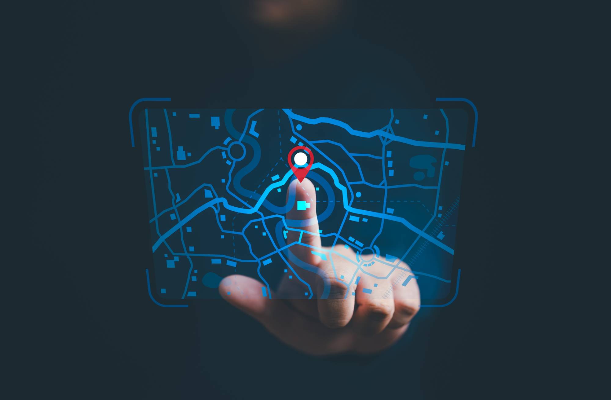 Person putting finger on someone's location tracking information on a screen.