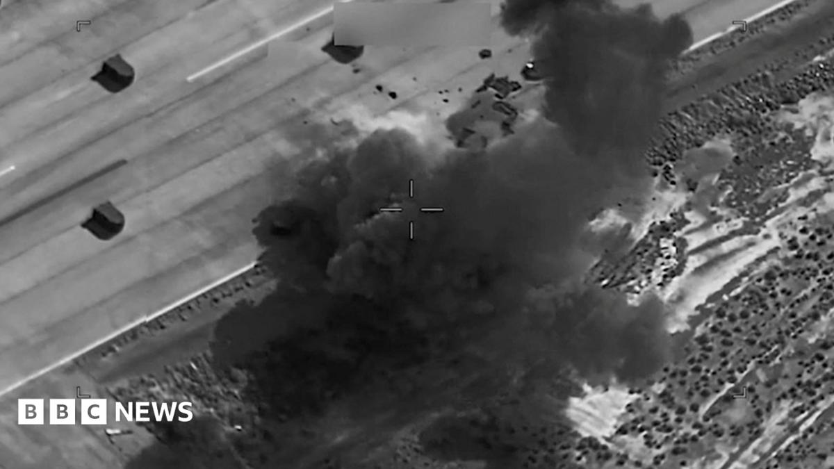 A black and white thermal imagery screengrab showing a US strike on a target in Iran.